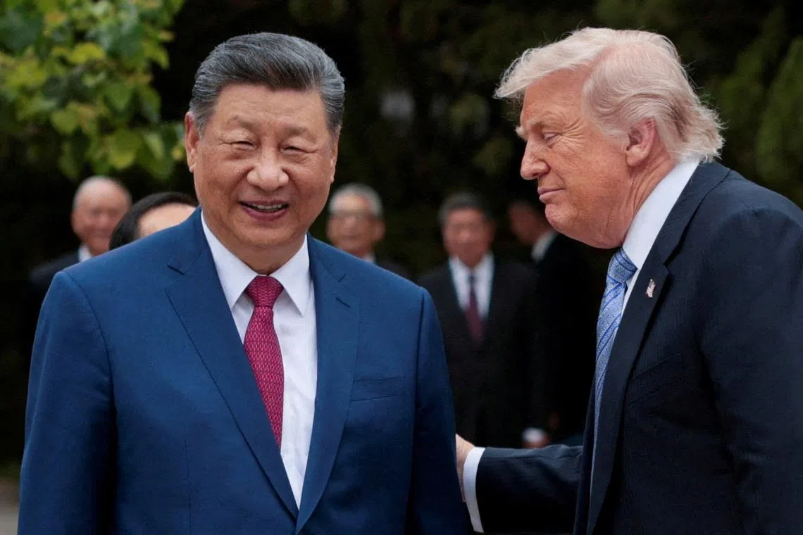 US President Donald Trump (right) speaks with Chinese President Xi Jinping while leaving after a visit to the Zhongnanhai Garden in Beijing, China, on May 15.
