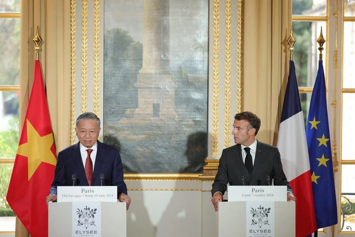 FILE PHOTO: French President Emmanuel Macron and Vietnam's President To Lam attend a joint press conference at the Elysee Palace in Paris, France, 07 October 2024. TERESA SUAREZ/Pool via REUTERS/File Photo