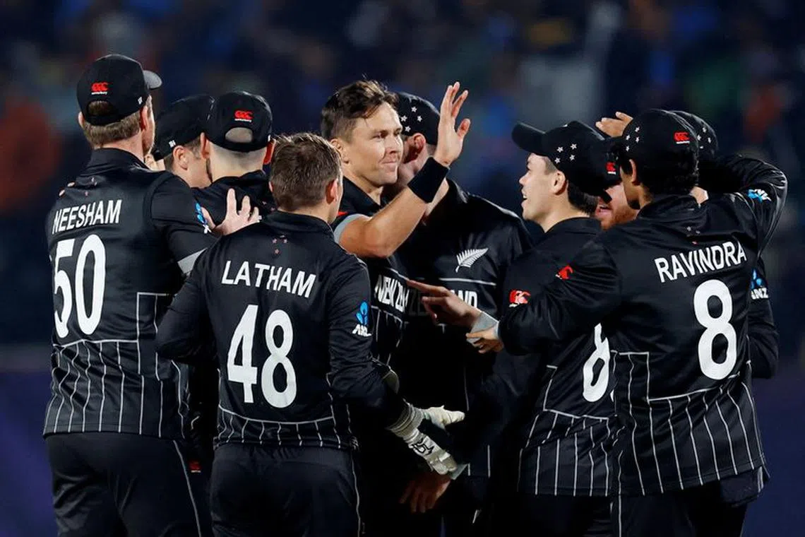 FILE PHOTO: Cricket - ICC Cricket World Cup 2023 - India v New Zealand - Himachal Pradesh Cricket Association Stadium, Dharamsala, India - October 22, 2023  New Zealand's Tom Latham celebrates with teammates after taking the wicket of India's Suryakumar Yadav run out off the bowling of Trent Boult REUTERS/Adnan Abidi/File Photo