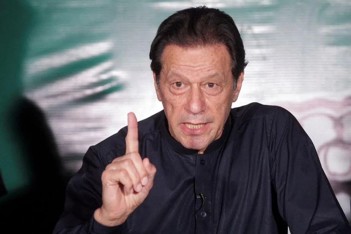 FILE PHOTO: Pakistan's former Prime Minister Imran Khan, gestures as he speaks to the members of the media at his residence in Lahore, Pakistan May 18, 2023. REUTERS/Mohsin Raza//File Photo/