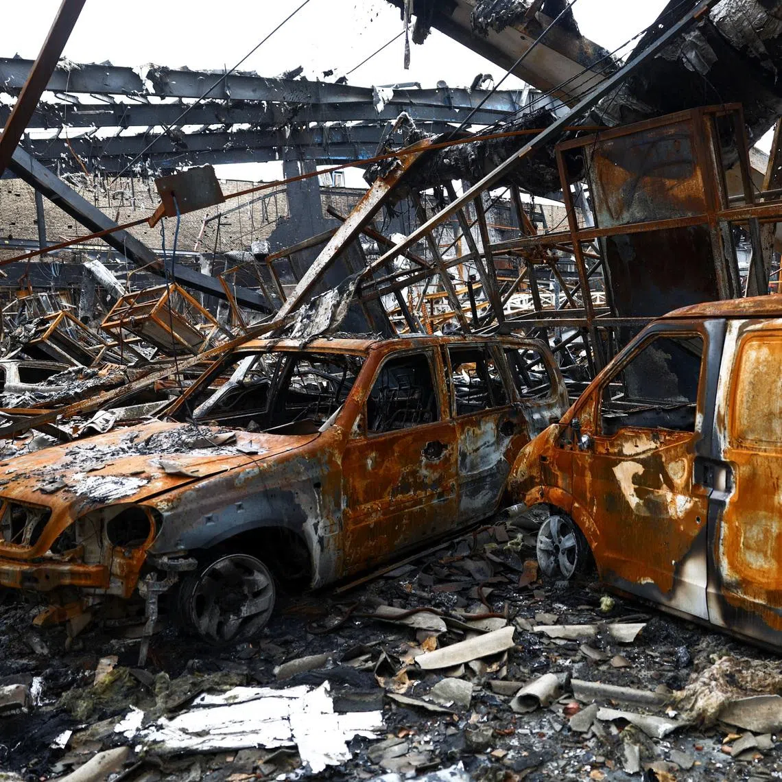 Burnt-out vehicles at the site of a car repair shop and dealership damaged by a strike, amid the U.S.-Israeli conflict with Iran, in Tehran, Iran, March 28, 2026. Majid Asgaripour/WANA (West Asia News Agency) via REUTERS