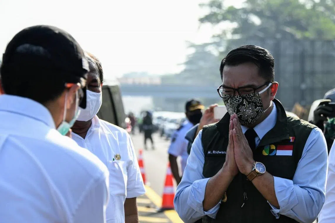 West Java Governor Ridwan Kamil at inspecting a toll road during the province's lockdown which began unwinding on June 1. The province now expects GDP growth of 2 percent up from its earlier forecast of a 2 percent contraction. 