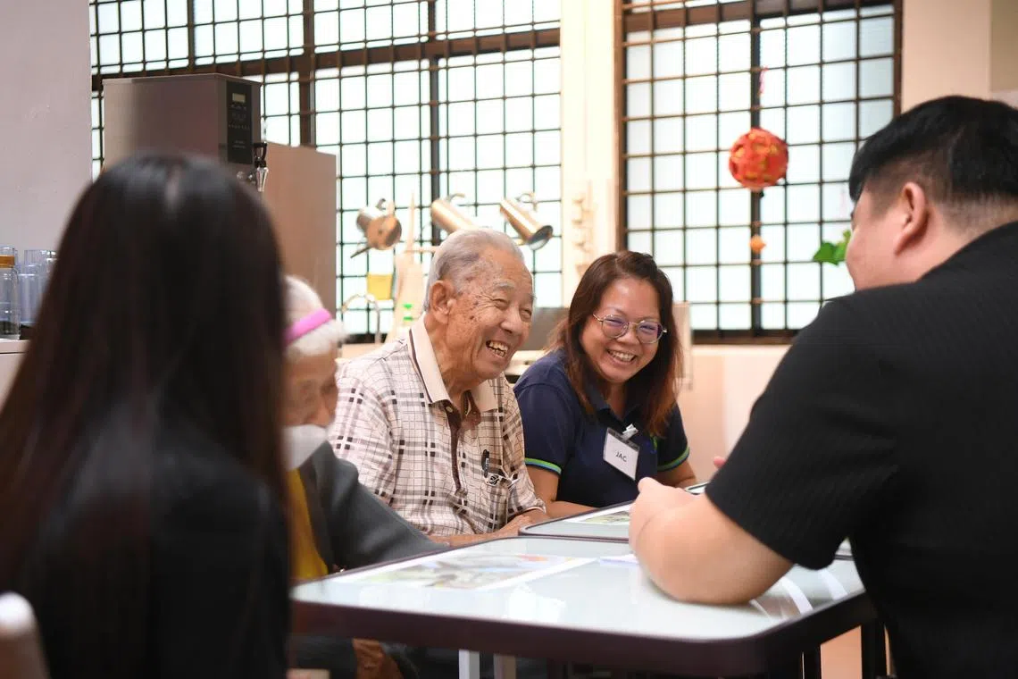 jtmeeting

Ms Jacqueline Teng (right) takes her father who is living with dementia, Mr Teng Hock Bee, 82, to the meeting centre at Onesimus Village in Mayflower.

Dementia Singapore piloted a Meeting Centre, which is a community space for persons living with dementia and their caregivers to meet one another, back in 2020, and hopes that more will be set up around Singapore.

(ST PHOTO: AZMI ATHNI)

