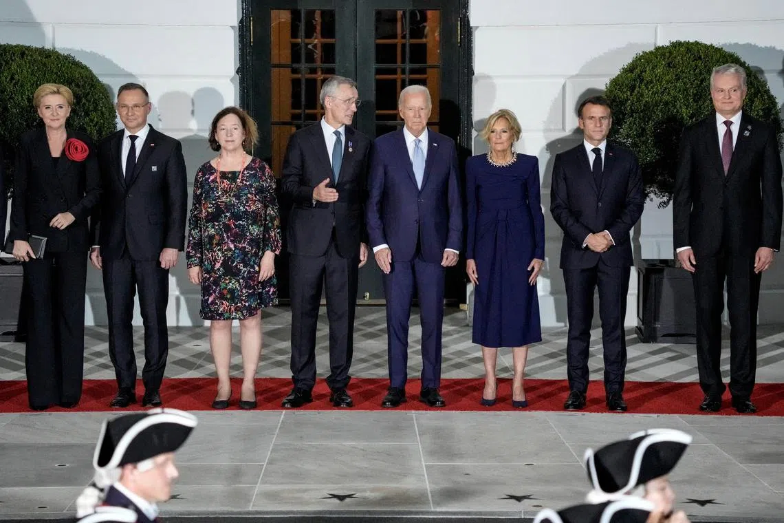 FILE PHOTO: U.S. President Joe Biden and first lady Jill Biden pose for a picture with NATO allies and partners ahead of a dinner at the White House in Washington, U.S., July 10, 2024. REUTERS/Ken Cedeno/File Photo