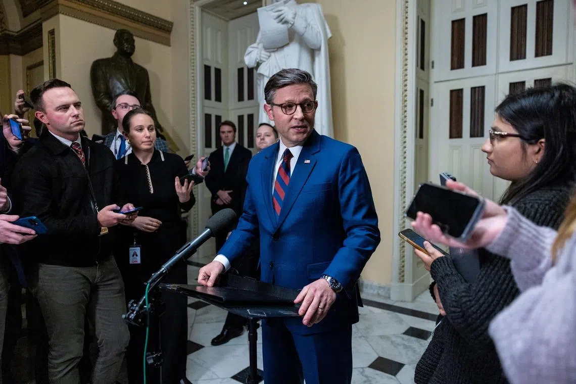FILE PHOTO: Speaker Mike Johnson (R-LA) speaks to reporters ahead of a vote to pass the American Relief Act on Capitol Hill in Washington, U.S., December 19, 2024. The legislation failed to pass the House in a 174-235 vote. REUTERS/Anna Rose Layden/File Photo