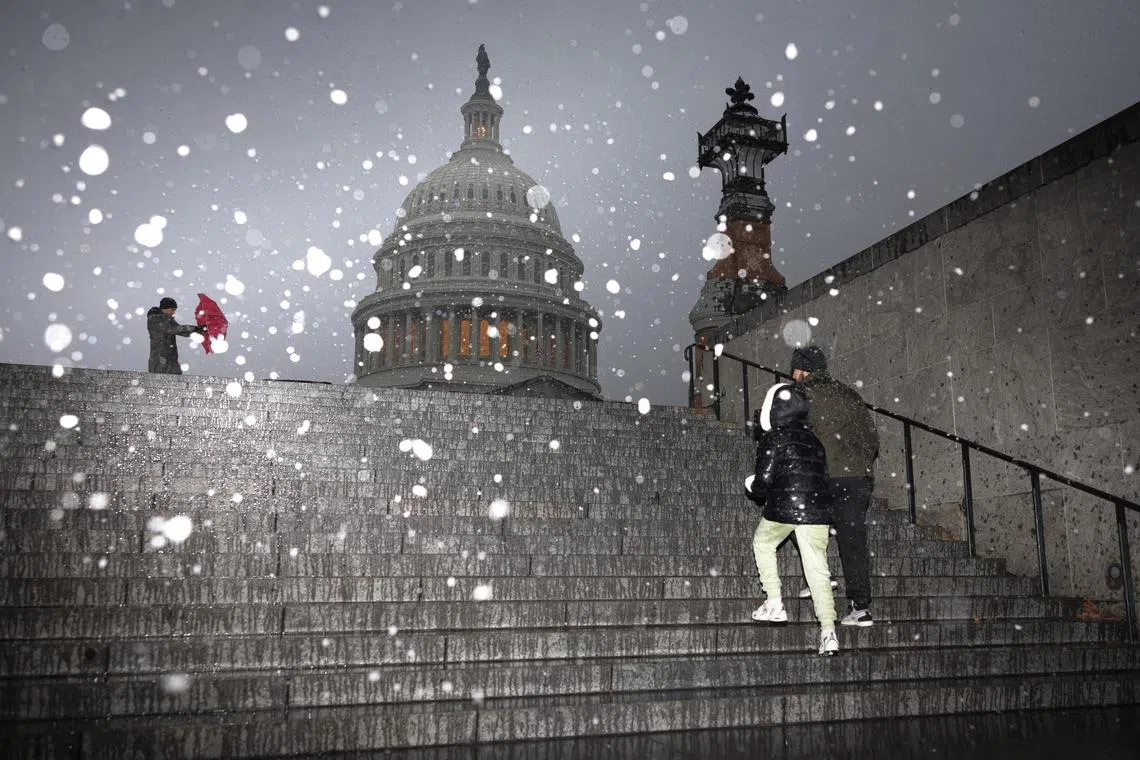 Snow falls near the Capitol in Washington, on Jan 3.