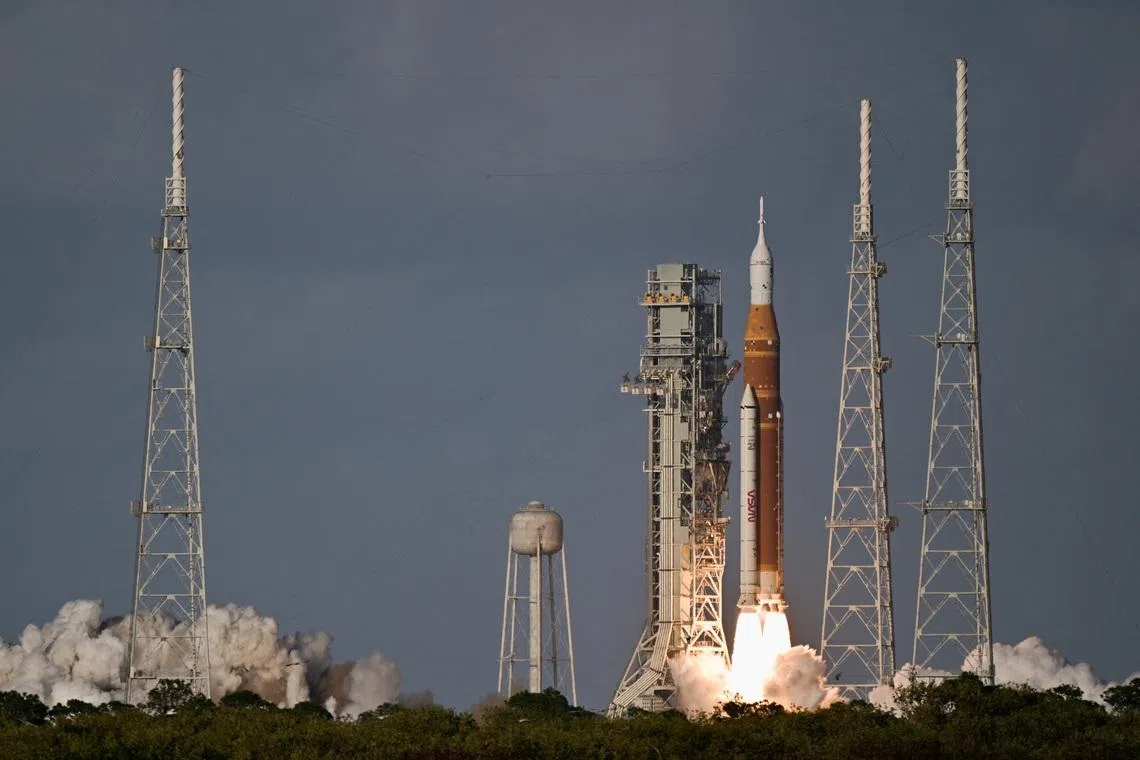 NASA's Artemis II mission to fly by the moon, comprising of the Space Launch System (SLS) rocket with the Orion crew capsule, lifts off from the Kennedy Space Center in Cape Canaveral, Florida, U.S. April 1, 2026.  REUTERS/Steve Nesius