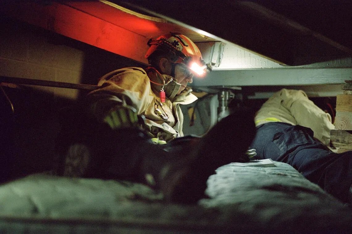 Jonathan Kleisner participates in a training simulation of a collapsed building at the department’s training academy in New York, Jan. 11, 2025. After making millions in a job he came to hate, Jonathan Kleisner joined the fire department as a rookie paramedic at the age of 41. Now he’s determined to be the best rescue medic anywhere. (Sean Jackson/The New York Times)