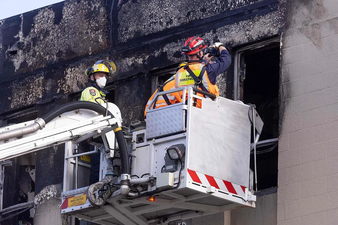 New Zealand police revised the confirmed death toll from the Loafers Lodge hostel fire to five.