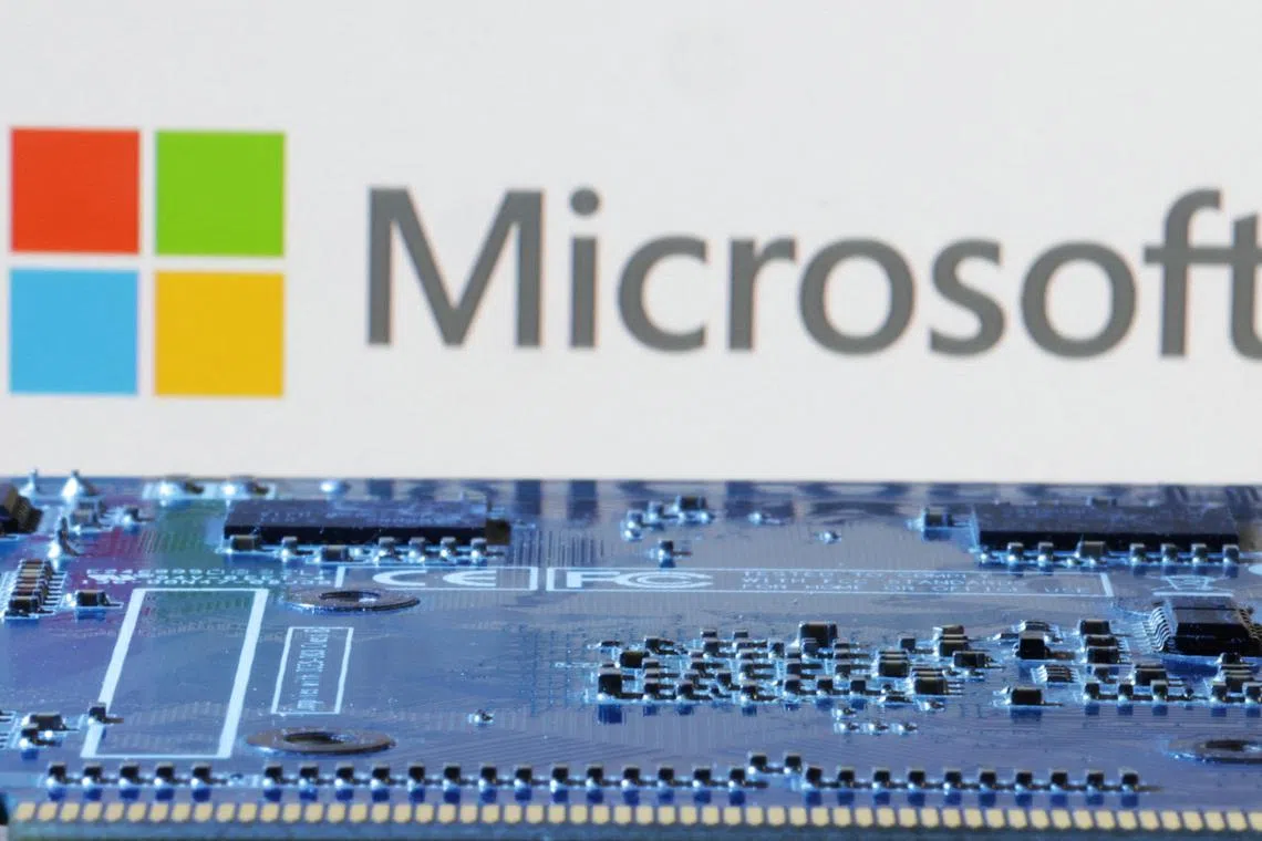 Microsoft logo is seen near computer motherboard in this illustration taken January 8, 2024. REUTERS/Dado Ruvic/Illustration