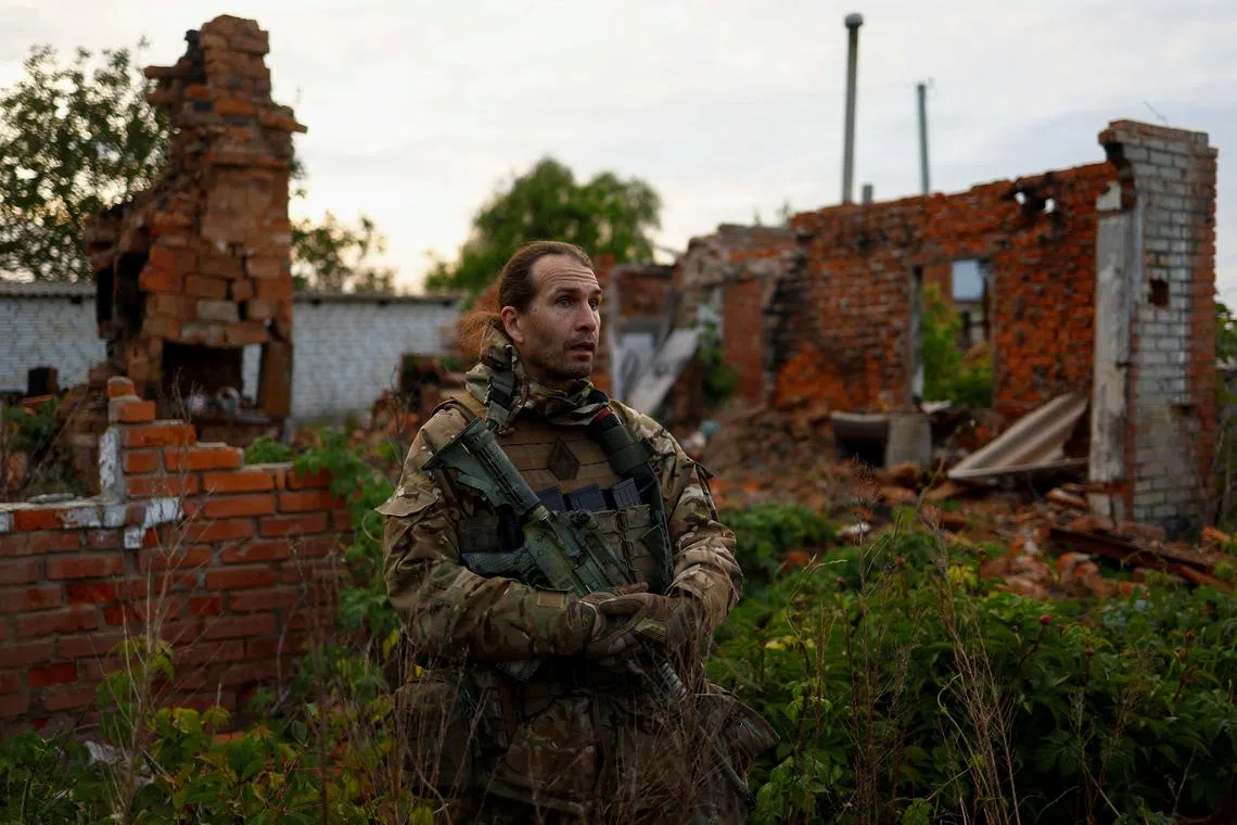 Deputy commander of the pro-Ukrainian Russian paramilitary group Freedom of Russia Legion Maksimilian Andronnikov with the call sign 'Caesar' speaks with Reuters after fighting with Russian troops near the border, amid Russia's attack on Ukraine, in Kharkiv region, Ukraine May 15, 2024. REUTERS/Valentyn Ogirenko