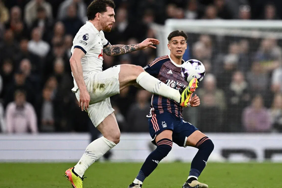 Soccer Football - Premier League - Tottenham Hotspur v Nottingham Forest - Tottenham Hotspur Stadium, London, Britain - April 7, 2024 Tottenham Hotspur's Pierre-Emile Hojbjerg in action with Nottingham Forest's Nicolas Dominguez REUTERS/Dylan Martinez
