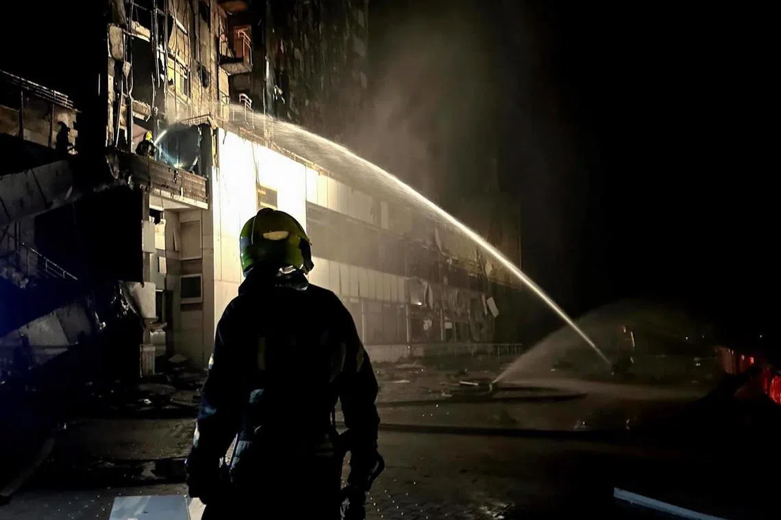 Firemen putting out a fire caused by a drone attack the southern Ukrainian city of Odessa, on Sept 25.