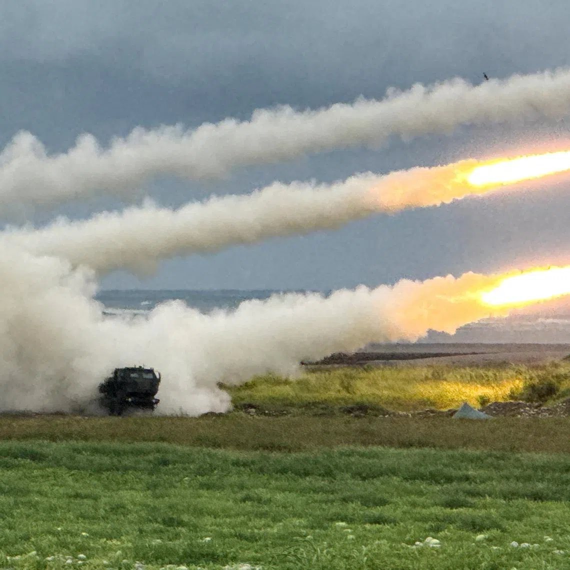 Taiwan's High Mobility Artillery Rocket Systems (HIMARS) fire rockets during a live-fire military exercise, which simulates an enemy invasion, in Taichung, Taiwan June 10, 2026. Picture taken with a mobile phone. REUTERS/Angie Teo