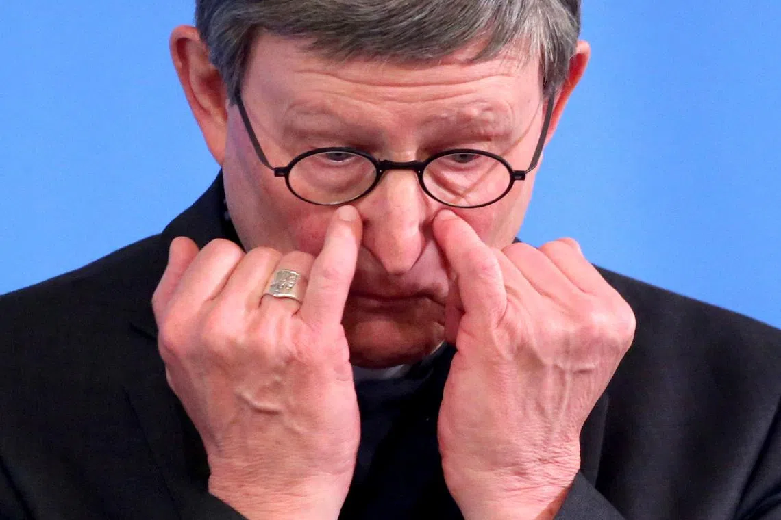 FILE PHOTO: Cardinal Rainer Maria Woelki, gives an update on the consequences and measures taken after an independent report on abuse cases at the Cologne archdiocese was released last week in Cologne, Germany, March 23, 2021. Oliver Berg/Pool via REUTERS