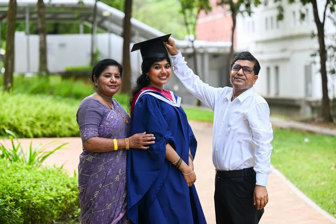Ms Lutfa Shazneen Hasan, 23, who graduated from Nanyang Technological University (NTU) in July with a bachelor’s degree in history, with her parents, Madam Sharmin Akther and Mr Zahurul Hasan, who are both 52.