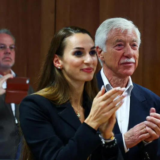 Candidate for Gelsenkirchen mayor from Germany's far-right Alternative for Germany party Norbert Emmerich (right), and Ms Enxhi Seli-Zacharias of AfD react to the exit polls for the North Rhine-Westphalian local elections.