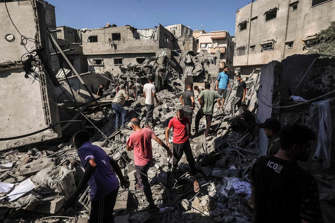 Palestinians inspect the damage after a house was targeted by an Israeli strike in the al-Bureij refugee camp in the central Gaza Strip on September 8, 2026. Despite a US-backed ceasefire that took effect in October 2025, violence has not halted in the Gaza Strip, with Israel continuing to target Palestinians it says are militants. (Photo by EYAD BABA / AFP)