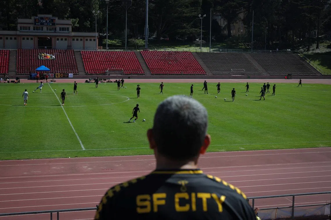 A fan watches a game between FC Davis and San Francisco City FC at the Kezar Stadium in San Francisco, California, U.S., May 17, 2026. REUTERS/Carlos Barria