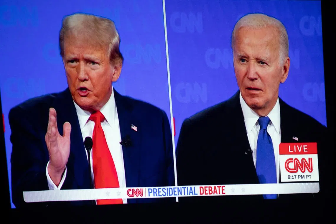 The first presidential debate between U.S. President Joe Biden and former U.S. President and Republican presidential candidate Donald Trump is projected on a screen projector during a watch party hosted by the Michigan Conservative Coalition in Novi, Michigan, U.S., June 27, 2024.     REUTERS/Emily Elconin