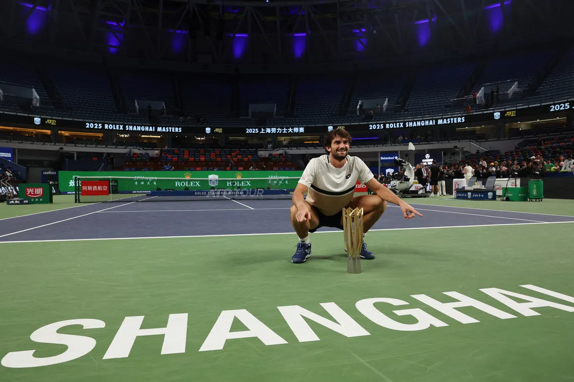 Tennis - ATP Masters 1000 - Shanghai Masters - Qizhong Forest Sports City Arena, Shanghai, China - October 12, 2025 Monaco's Valentin Vacherot celebrates with the trophy after winning the final against France's Arthur Rinderknech REUTERS/Go Nakamura