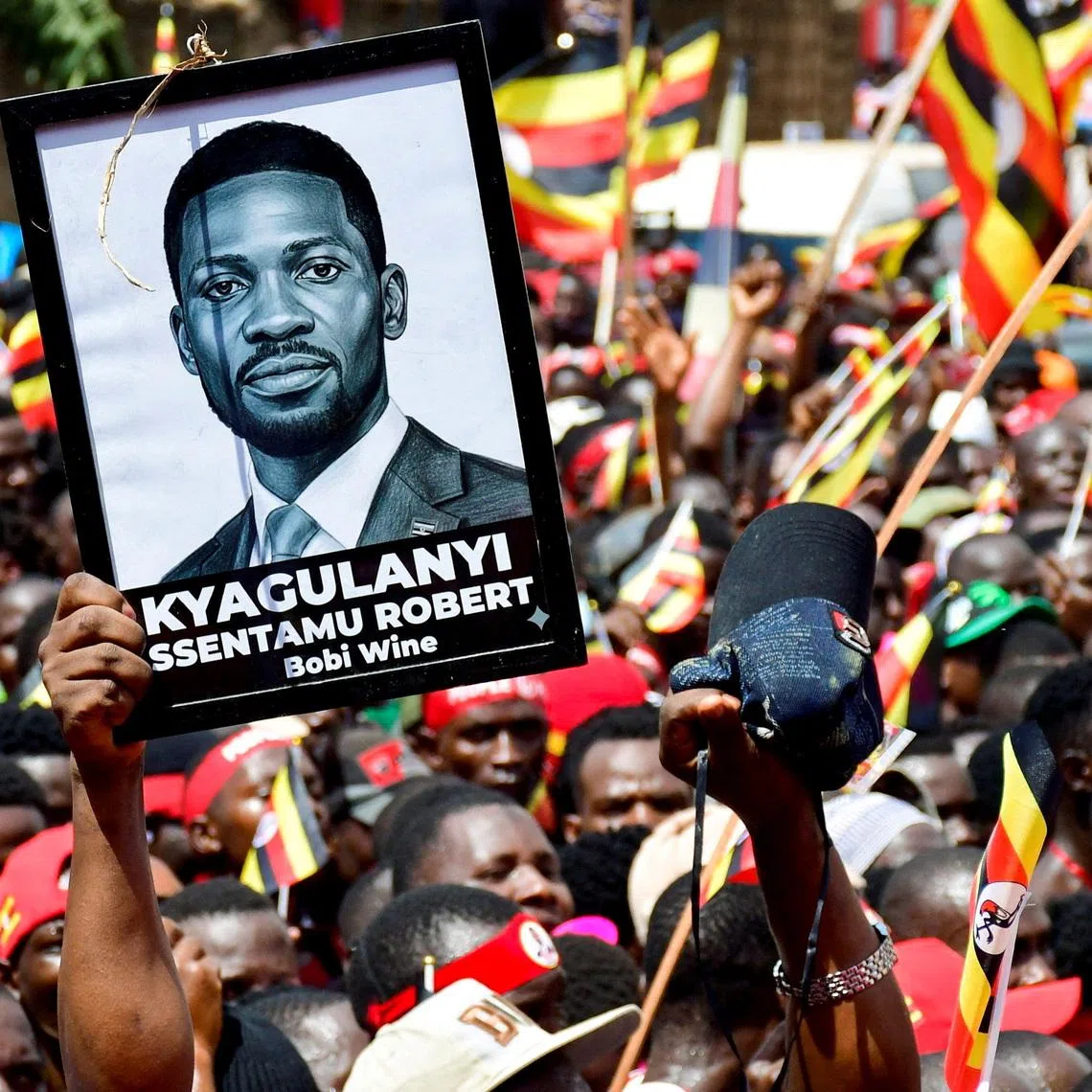 FILE PHOTO: Supporters of Ugandan Presidential candidate Robert Kyagulanyi, also known as Bobi Wine, of the National Unity Platform (NUP) party, attend his campaign caravan ahead of the general elections in Kampala, Uganda December 15, 2025. REUTERS/Abubaker Lubowa/File Photo