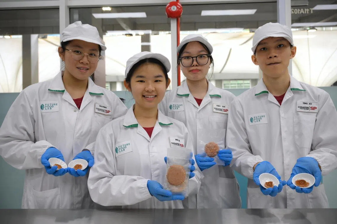 Students from Singapore Polytechnic's Food Science and Technology Diploma course (from left) Ms Destinee Tan, Ms Esther Chong, Ms Abby Tan and Mr Lim Ting Xu  developed a plant based meat patty at the school's new Future Food Lab.