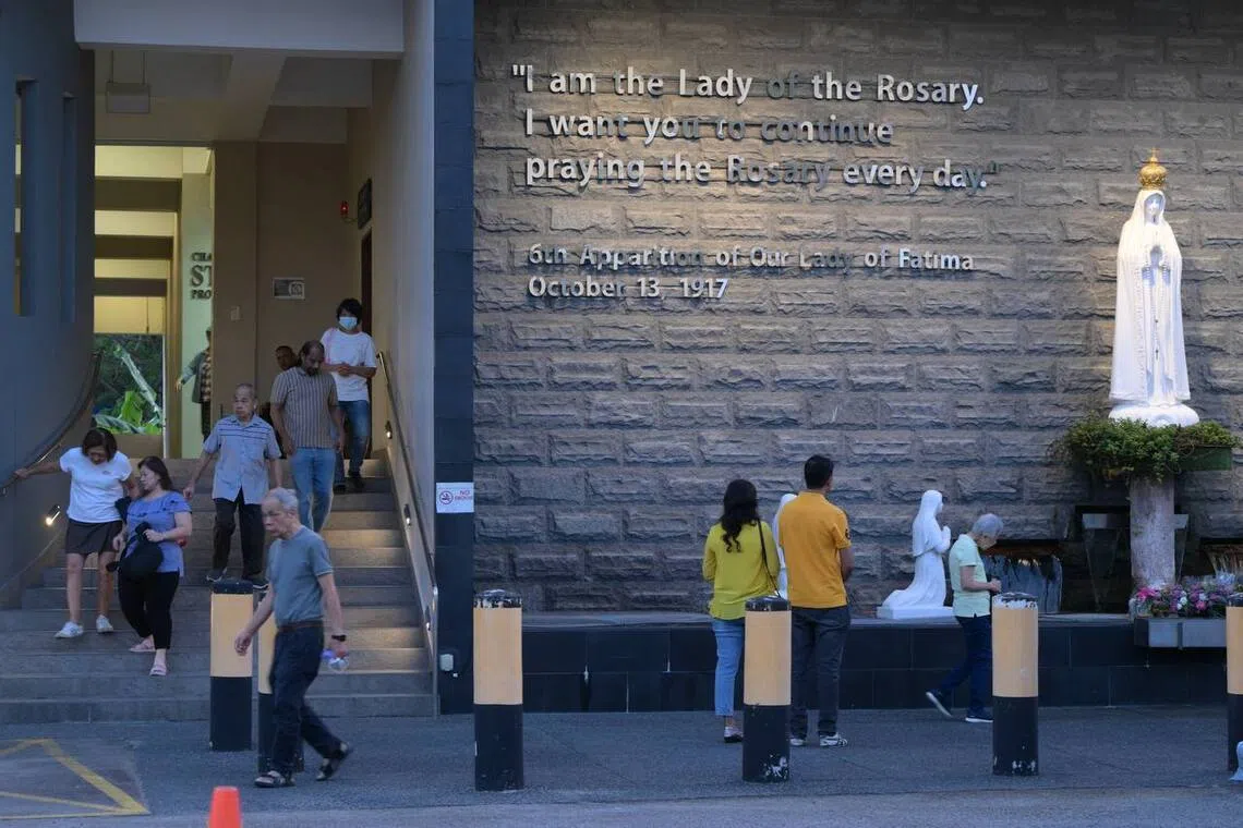 Churchgoers leaving after mass at St Joseph's Church on Dec 22, 2025.