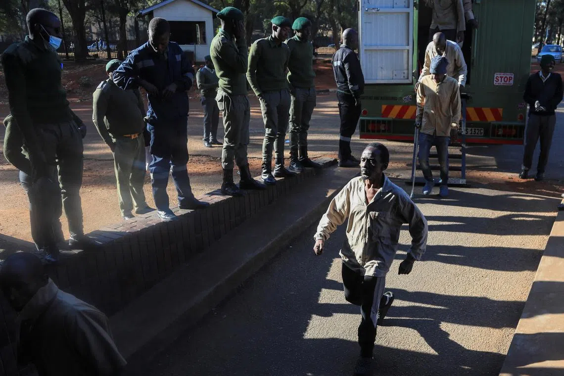FILE PHOTO: Opposition leader Jameson Timba of the Citizens Coalition for Change (CCC) party, arrested for holding a political gathering that authorities said was unauthorized, walks after disembarking a prison truck as he arrives for bail application at the Harare Magistrates' court, in Harare, Zimbabwe June 21, 2024. REUTERS/Philimon Bulawayo/File Photo
