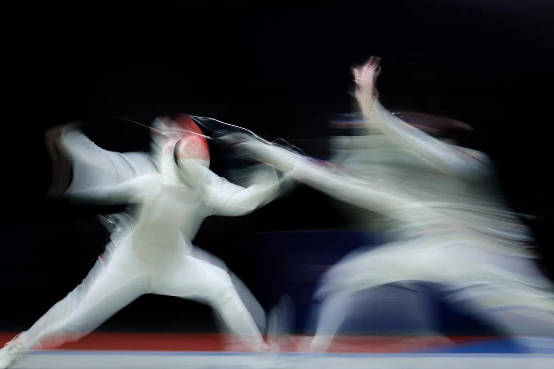 Singapore fencer Amita Berthier (left) competing during the women’s foil team final at Fashion Island Shopping Mall in Bangkok on Dec 19.