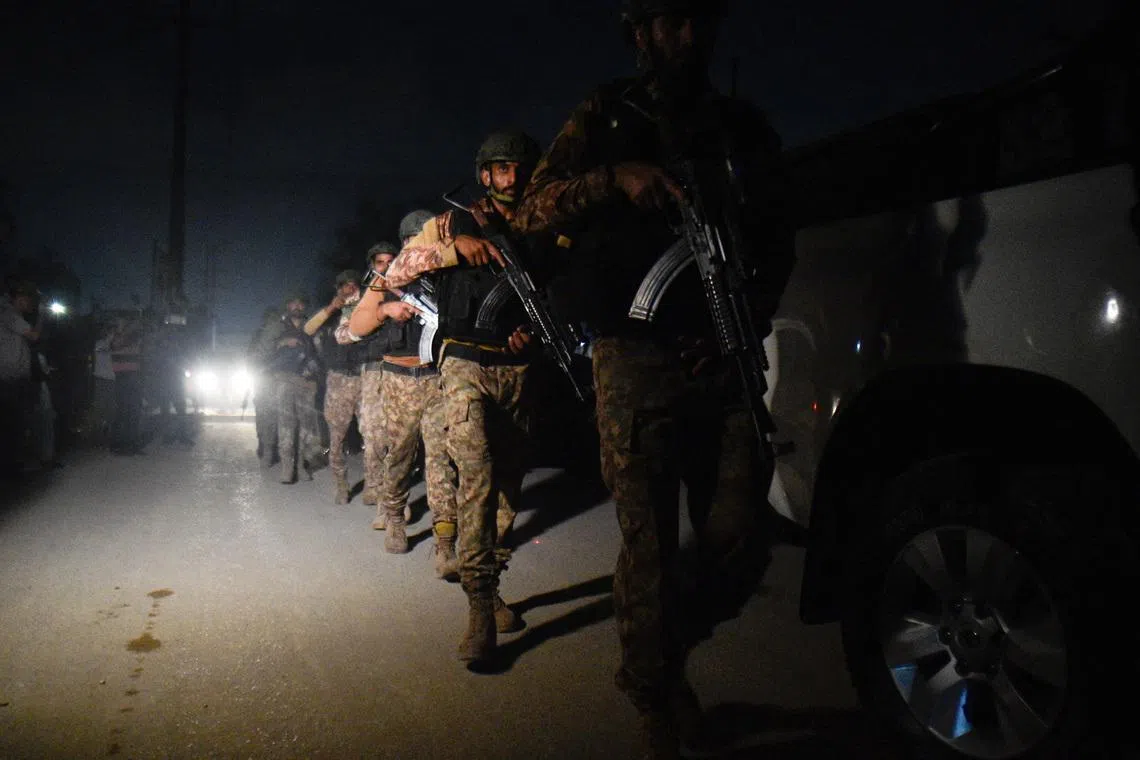 Security personnel patrols after an explosion and gunfire were reported, near offices of the Rangers, a paramilitary force, in Karachi, Pakistan, June 27, 2026. REUTERS/ Qaiser Khan
