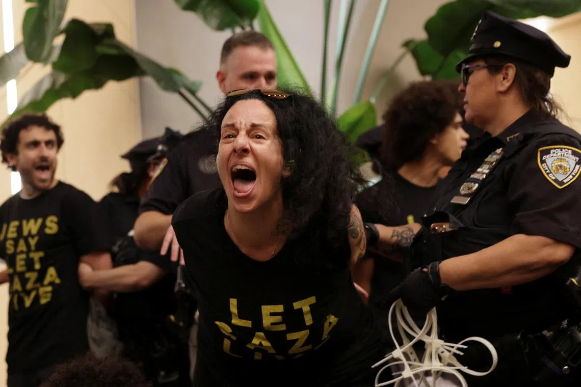 More than 100 protesters, who were organised by anti-war group Jewish Voice for Peace, chanted and banged pots and pans in the lobby of the Third Avenue building where the two senators have office space.