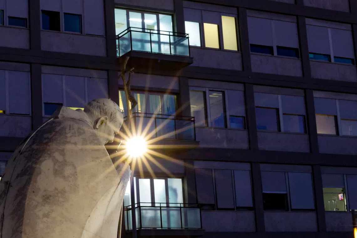 The statue of Pope John Paul II stands outside Agostino Gemelli Hospital in Rome, where Pope Leo underwent surgery.