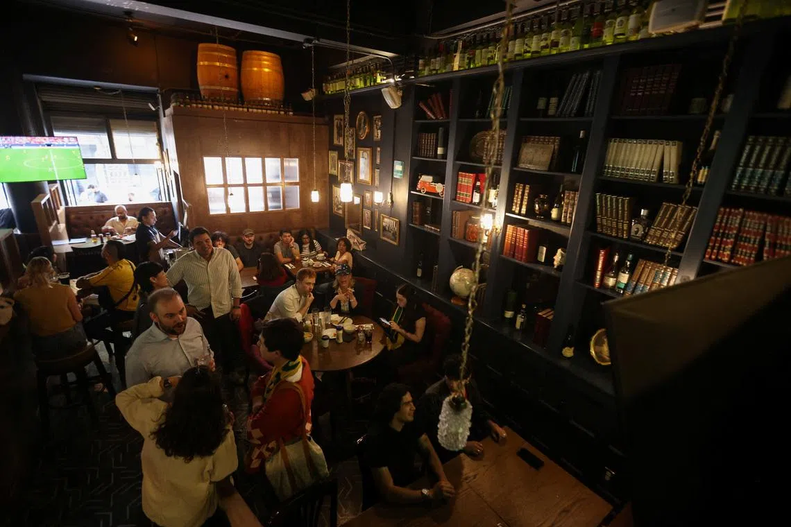 People watch a FIFA World Cup 2026 match at the Duke of Lisbon pub, a British-Mexican bar, that expects to see fans gather to watch the match between Mexico and England in the World Cup Round of 16, in Mexico City, Mexico, July 3, 2026. REUTERS/Quetzalli Nicte-Ha