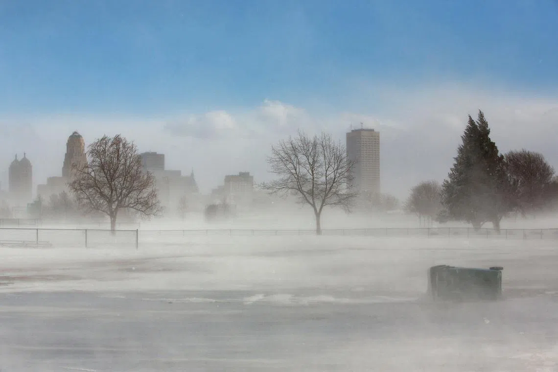 FILE PHOTO: The city skyline is seen in drifting snow during the polar vortex in Buffalo, New York, U.S., January 31, 2019. REUTERS/Lindsay DeDario/File Photo