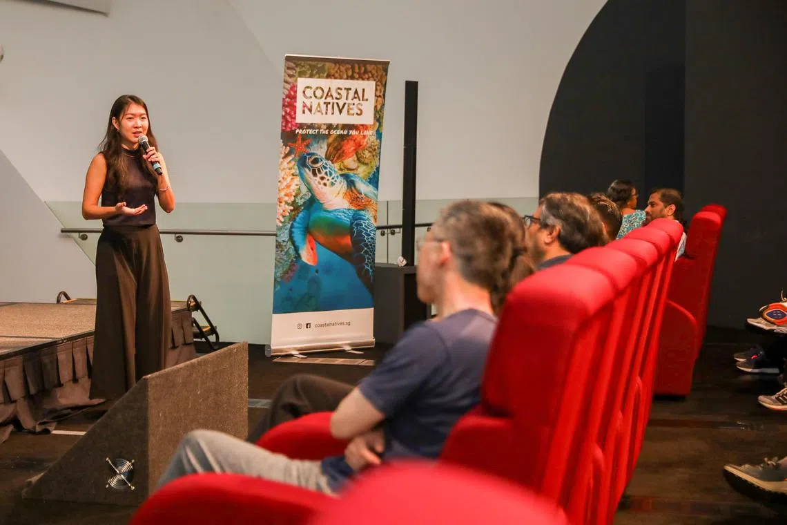 Visitors sit for a talk at the Waves Of Change Festival at the ArtScience Museum.