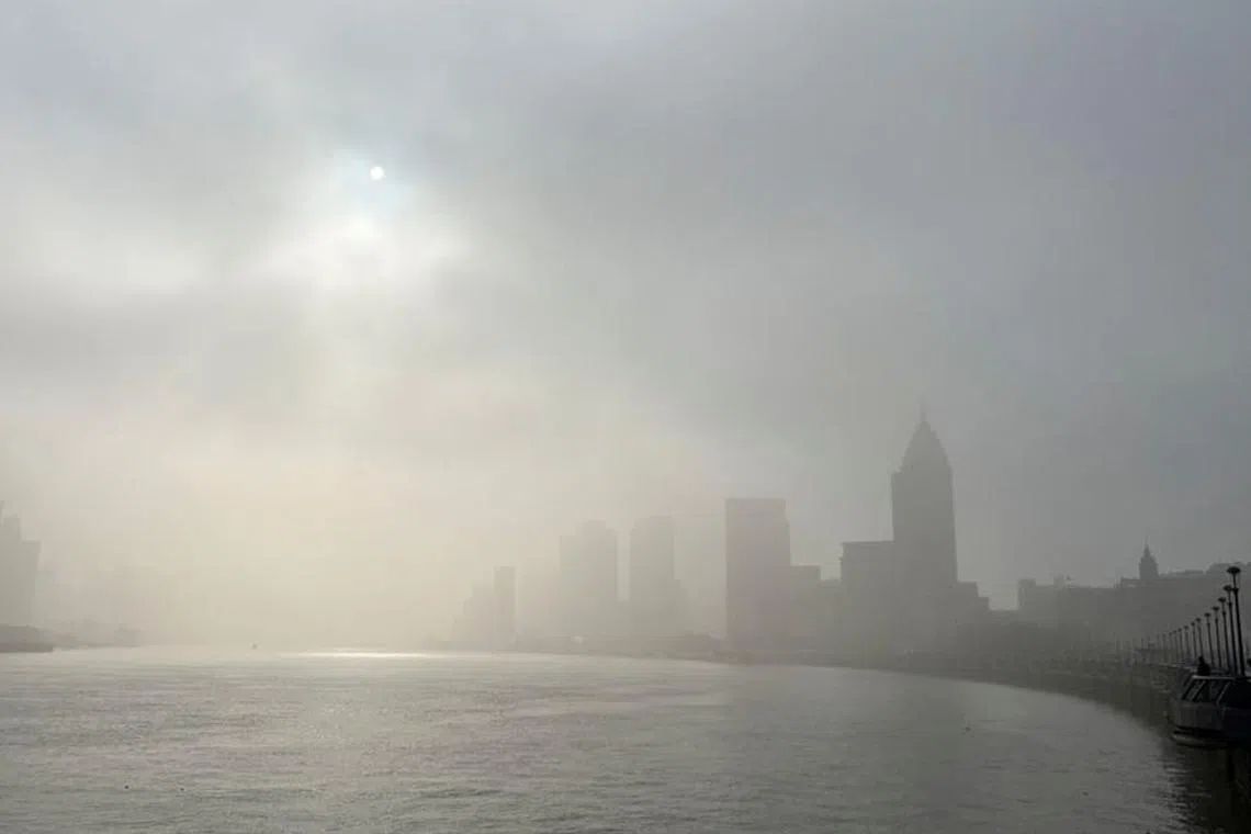 Buildings along the Huangpu river are seen shrouded in fog, amid a red alert for heavy fog in Shanghai, China December 29, 2023. REUTERS/Xihao Jiang/ File photo