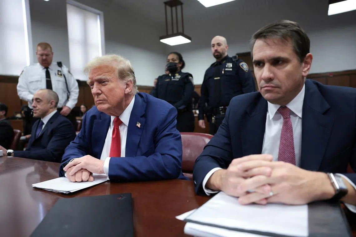 Former US President Donald Trump and his attorney Todd Blanche attend Trump's trial for allegedly covering up hush money payments at Manhattan Criminal Court on May 6.