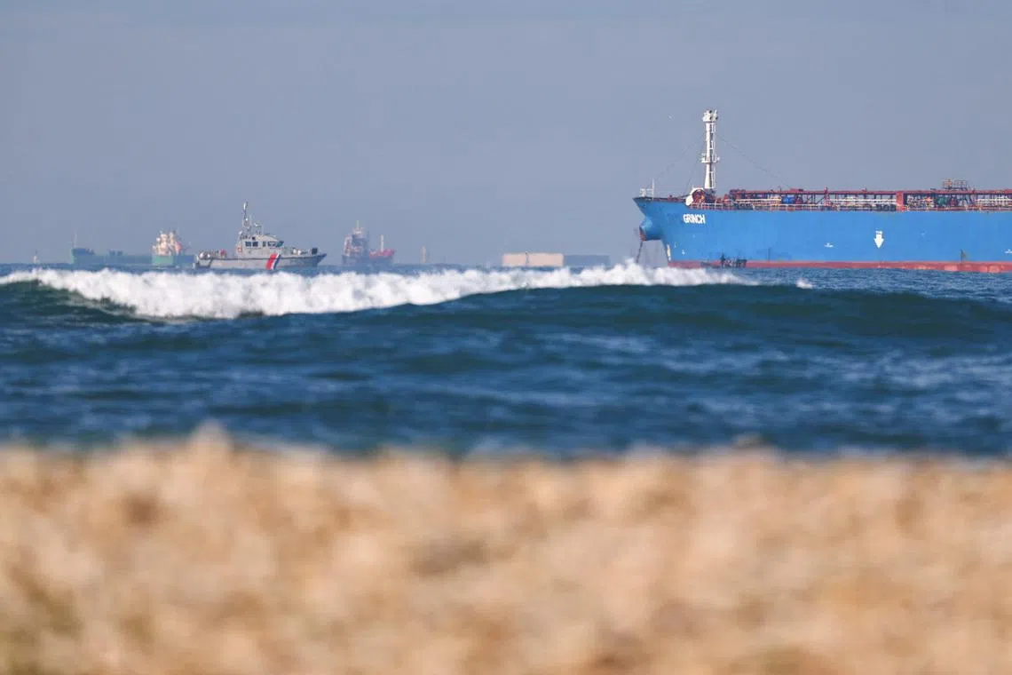 A French navy boat surrounds the GRINCH oil tanker, intercepted by France in the Alboran Sea on suspicion of operating under a false flag and belonging to Russia's shadow fleet that enables Russia to export oil despite sanctions, and diverted to the port of Marseille-Fos, in the Gulf of Fos-sur-Mer, near Martigues, France, January 25, 2026. REUTERS/Manon Cruz/File Photo