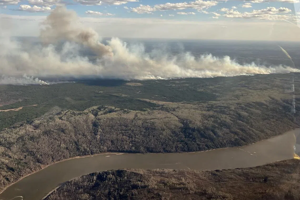 The Athabasca River valley near Fort McMurray, May 10, 2024. Alberta Wildfire/Handout via REUTERS