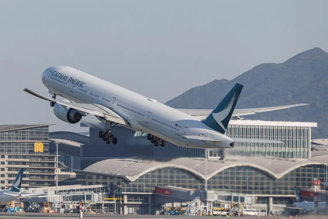 A Cathay Pacific aircraft takes off at Hong Kong International Airport on the day of the official launch of its third runway, in Hong Kong, China November 28, 2024.\