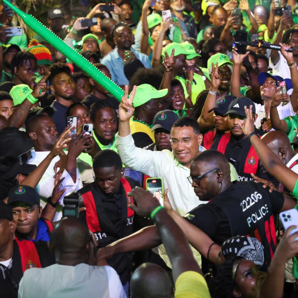 Jamaica's Prime Minister Andrew Holness walks amidst supporters after the ruling Labour Party declared victory in the general election, ushering in a third consecutive term for Holness, in Kingston, Jamaica September 4, 2025. REUTERS/Gilbert Bellamy