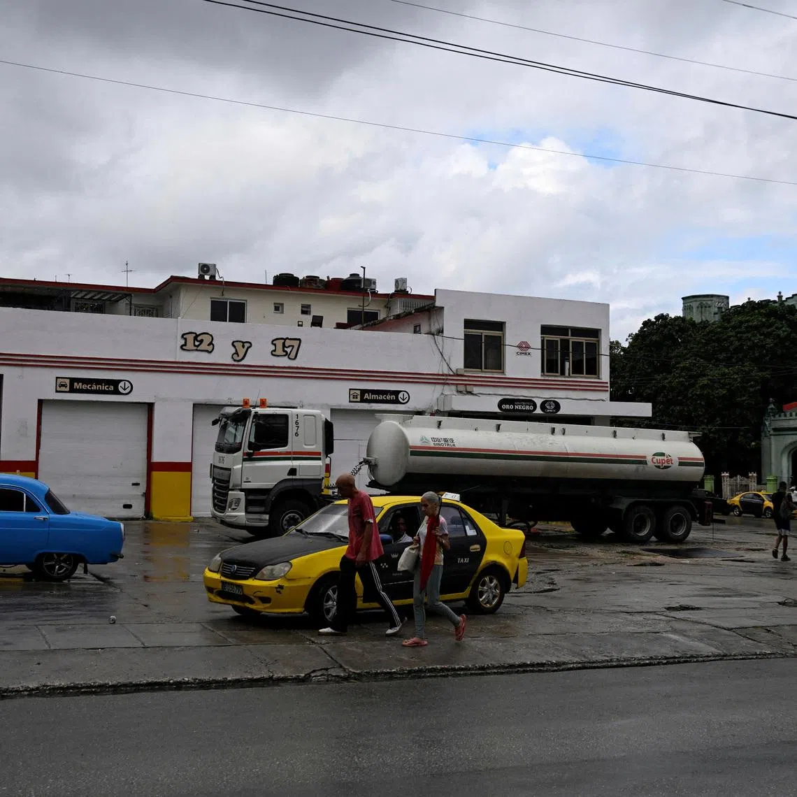 FILE PHOTO: A fuel truck from Cuba's state oil company CUPET refills a gas station, after U.S. President Donald Trump vowed to stop Venezuelan oil and money from reaching the island as Cubans brace for worsening fuel shortages amid regular power outages, in Havana, Cuba January 12, 2026. REUTERS/Norlys Perez/File Photo