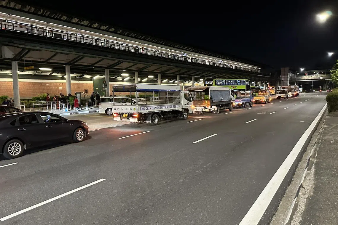 On average, 10 trucks would wait in line just before the public bus bay outside Kranji MRT station for the throngs of people who rush for a seat to return to their dorms.