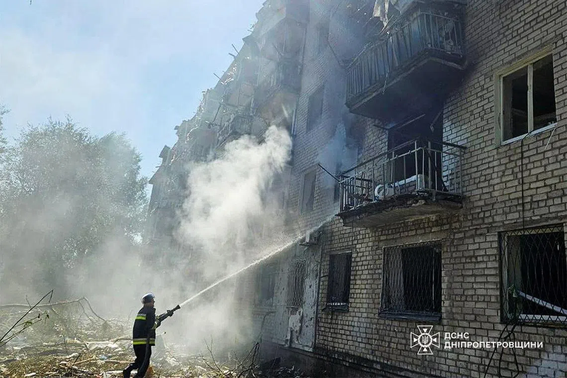 A firefighter working at the site of a Russian missile strike, in the central Ukrainian city of Pavlohrad, on Sept 6.