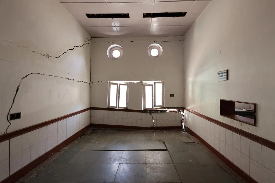 Broken windows and cracks are seen inside a sports centre, which was part of a residential complex for workers at Jaypee, a construction and power company, in Joshimath, in the northern state of Uttarakhand, India, Jan 15, 2023. 
