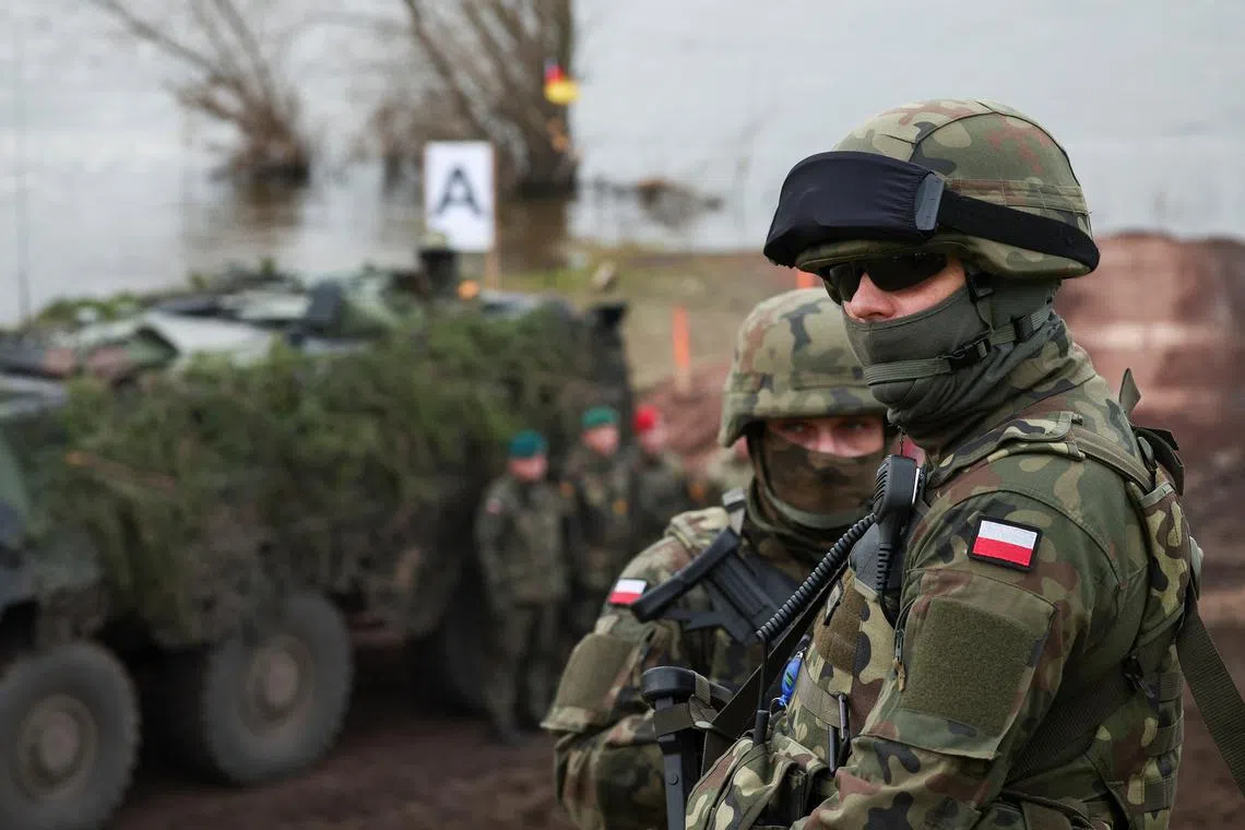 FILE PHOTO: Polish soldiers take part in NATO Dragon-24, part of the Steadfast Defender 2024 exercise, in Korzeniewo, Poland, March 4, 2024. REUTERS/Kacper Pempel/File photo