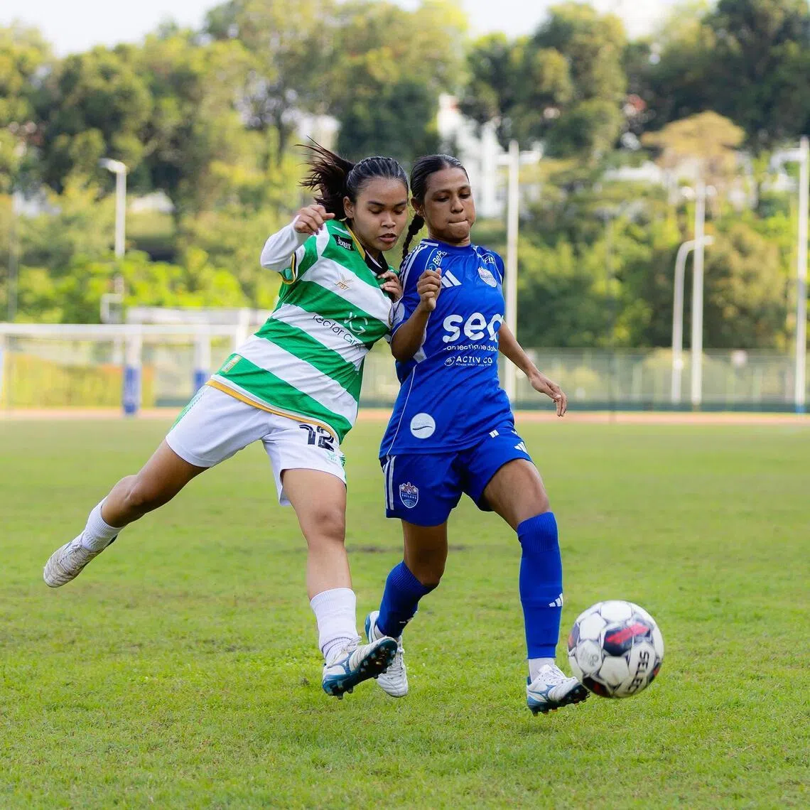 Geylang International's Elyssa Qistina (left) and Lion City Sailors' Dhaniyah Qasimah jostling for the ball on the last match day of the 2025 WPL season.