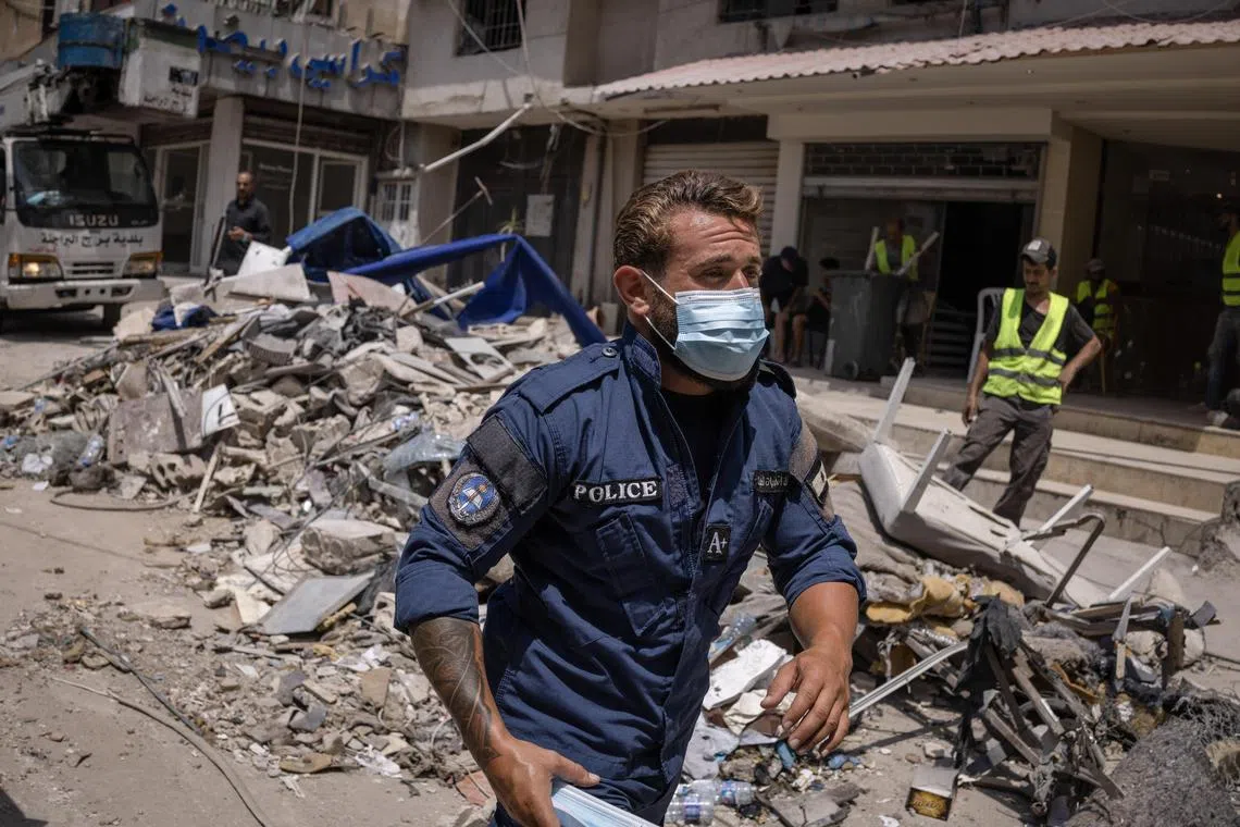 Rescue workers at the scene of an Israeli airstrike in Dahiyeh, a suburb of Beirut, Lebanon, on Wednesday, July 31, 2024. Israel’s Tuesday night strike on Fuad Shukr, a senior Hezbollah commander in Beirut, was the first time during this war that Israel has targeted such an influential Hezbollah leader in Lebanon’s capital. (Diego Ibarra Sánchez/The New York Times)