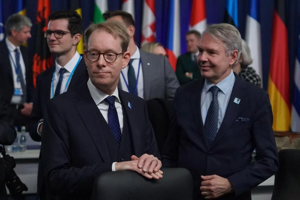 Sweden's Foreign Minister Tobias Billstrom (left) and Finland's Foreign Minister Pekka Haavisto attend a meeting of Nato Foreign Ministers in Bucharest, on Nov 29, 2022.